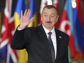 FILE- In this file photo taken on Friday, Nov. 24, 2017, Azerbaijan's President Ilham Aliyev waves as he arrives for an Eastern Partnership Summit in Brussels. Ilham Aliyev, who has ruled the oil-rich Caspian Sea nation since 2003, had been expected to seek re-election in November 2018, but his office announced on Monday Feb. 5, 2018, that an early election would be held in April.