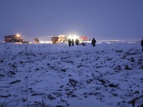 In this photo provided by the Russian Ministry for Emergency Situations RMES employees work at the scene of a AN-148 plane crash in Stepanovskoye village, about 40 kilometers (25 miles) from the Domodedovo airport, Moscow, Russia, Sunday, Feb. 11, 2018. The Saratov Airlines regional jet disappeared from radar screens a few minutes after departing from Domodedovo Airport en route to Orsk, a city some 1,500 kilometers (1,000 miles) southeast of Moscow. Russian officials say all passengers aboard the airliner are believed to have been residents of the region that was the plane's destination. No survivors have been reported. (Russian Ministry for Emergency Situations photo via AP)