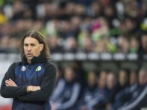 FILE - In this Feb. 17, 2018 file photo VfL Wolfsburg coach  Trainer Martin Schmidt  attends the soccer match between VfL Wolfsburg and Bayern Munich in Wolfsburg, northern Germany. Schmidt resigned as coach, the club announced on their homepage Monday, Feb. 19, 2018.