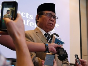 Moro Islamic Liberation Front Chair Al Haj Murad Ebrahim talks to foreign correspondents based in the Philippines following a forum Tuesday, Feb. 20, 2018 in Manila, Philippines. The leader of the largest Muslim rebel group in the Philippines says Islamic State group-aligned militants planned but failed to attack one of two other southern cities after their deadly siege to Marawi city was crushed last year.