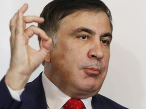 Mikheil Saakashvili, former Georgian president-turned-Ukrainian opposition leader, speaks to reporters in Warsaw, Poland, Tuesday, Feb. 13, 2018. Saakashvili was deported from Ukraine to Poland on Monday after being detained by armed, masked men at a restaurant in Kiev and rushed to the airport.