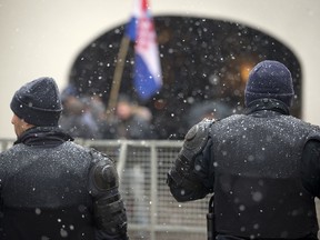 Police cordons off the government building area to prevent protesters access ahead of Serbia's president Aleksandar Vucic visit in Zagreb, Croatia, Monday, Feb. 12, 2018. President Vucic is on two day state visit to Croatia.