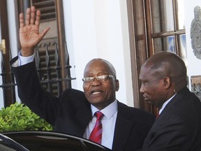 FILE - In this Feb. 6, 2018, file photo, South African President Jacob Zuma, left, waves as he leaves parliament in Cape Town, South Africa. Leaders of South Africa's ruling ANC party are struggling to remove Zuma from office amid reports he asked for concessions in exchange for his resignation.The African National Congress says it will announce the results of a marathon meeting of its national executive committee at noon on Tuesday Feb, 13, 2018. (AP Photo)
