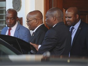 South African President Jacob Zuma leaves parliament in Cape Town, South Africa, Wednesday, Feb 7, 2018. Zuma's exit from power because of scandals appears to be getting closer with his deputy, Cyril Ramaphosa, who is expected to replace him, saying he anticipates a "speedy resolution" to transition talks he is holding with Zuma.