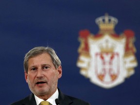 EU Enlargement Commissioner Johannes Hahn speaks during a press conference after talks with Serbia's President Aleksandar Vucic, in Belgrade, Serbia, Wednesday, Feb. 7, 2018. Hahn says Serbia must reach an agreement on normalization of relations with Kosovo if it wants to join the block.
