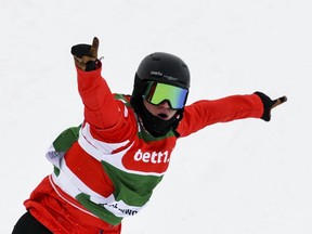 Austria's Julian Lueftner celebrates his victory after the Men's snowboard-cross World Cup race at Feldberg mountain, in the Black Forest, Germany, Saturday, Feb. 3, 2018.