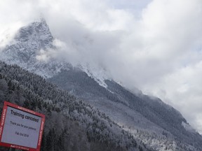 A sign reads: Training Canceled, in Garmisch-Partenkirchen, Germany, Friday, Feb. 2, 2018. The training for the women's downhill World Cup was canceled due to bad weather conditions. he International ski federation says course workers need more time as "conditions on the slope" after Thursday's rain and snowfall are not good enough to stage the training, despite improved weather with spells of sunshine.