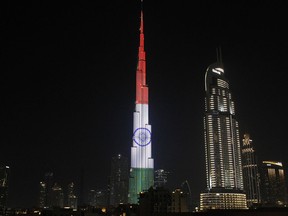 The Burj Khalifa, the world's tallest building, displays the flag of India in Dubai, United Arab Emirates, Saturday, Feb. 10, 2018. Indian Prime Minister Narendra Modi arrived in the UAE on Saturday night as part of a tour of the Middle East.