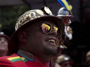 A musician smiles during the Carnival in Oruro, Bolivia, Saturday, Feb. 10, 2018. Thousands of colorfully dressed dancers and musicians kick off Carnival celebrations in the Bolivian city of Oruro.