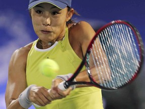 Qiang Wang of China returns the ball to Elina Svitolina of Ukraine during the Dubai Duty Free Tennis Championship in Dubai, United Arab Emirates, Wednesday, Feb. 21, 2018.