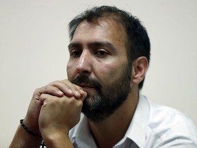 Isaac Givovich Contador, waits during a press conference, after giving testimony as a child victim of sexual abuse, in Santiago, Chile, Friday, February 9, 2018. The Marist Brothers of Chile opened a canonical investigation about the case of sexual abuse that shakes their congregation, which began with the declaration of the first of the victims, Isaac Givovich Contador.