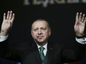 Turkey's President Recep Tayyip Erdogan, gestures as he attends a national youth foundation event in Ankara, Turkey, Thursday, Feb. 1, 2018. Syrian government forces pushed into an opposition stronghold on Thursday, as Turkish troops and allied Syrian fighters battled with Kurdish militants in a nearby area.