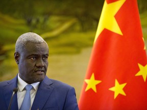 Chairman of the African Union Commission Moussa Faki Mahamat speaks during a joint press conference with Chinese Foreign Minister Wang Yi at the Ministry of Foreign Affairs in Beijing, Thursday, Feb. 8, 2018. Chinese and African officials have lashed out at a recent report alleging Chinese workers bugged the African Union headquarters and suggested it was a ploy to destabilize relations.