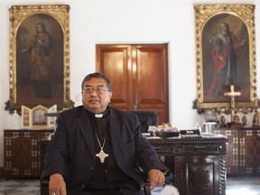 In this Dec. 2, 2011 photo, Archbishop of the Roman Catholic Archdiocese of Guatemala Oscar Julio Vian poses for photos during an interview, at the Archbishop Palace in Guatemala City. Roman Catholic authorities said Saturday, Feb. 24, 2017, that Vian, an outspoken critic of corruption in the Central American nation, has died.