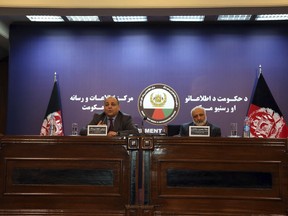 Wais Ahmad Barmak, interior minister, left, and Masoom Stanekzai Afghanistan's intelligence chief, right, speaks during a joint press conference in Kabul, Afghanistan, Thursday, Feb. 1, 2018. At the news conference Wais Ahmed Barmak said they has given neighboring Pakistan confessions and other proof that the militants who carried out a recent series of attacks were trained in Pakistan and that Taliban leaders there are allowed to roam freely.