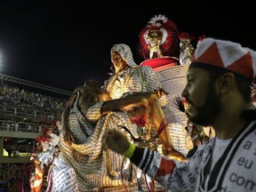 Performers from the Salgueiro samba school parade on a float during Carnival celebrations at the Sambadrome in Rio de Janeiro, Brazil, early Tuesday, Feb. 13, 2018.