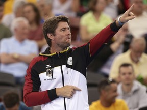 German team captain Michael Kohlmann reacts after they won a point at the Davis Cup World Group first round between Australia and Germany in Brisbane, Australia, Friday, Feb.2, 2018.