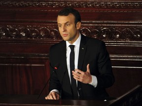 Emmanuel Macron addresses the Tunisian parliament in Tunis, Thursday, Feb.1 2018. Macron is on a two-day visit to Tunisia, a budding democracy that is struggling economically while contending with Islamic extremists.