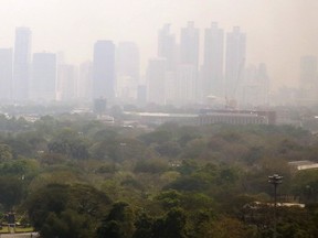 A thick smog hangs over downtown Bangkok, Thailand, early Thursday, Feb. 8, 2018. The Bangkok Real-time Air Quality Index shows unhealthy levels of PM2.5 (Particulates per Million) in the day. (AP Photo)