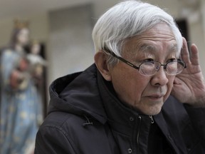 Retired archbishop of Hong Kong Cardinal Joseph Zen gestures during an interview in Hong Kong, Friday, Feb. 9, 2018. Zen has warned that a deal between the Vatican and China that cedes too much power to Beijing would place the country's Catholic followers in a big "birdcage."