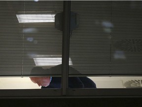 Information Commissioner's Office enforcement officers work inside the offices of Cambridge Analytica in central London after a High Court judge granted a search warrant, Friday March 23, 2018.  The investigation into alleged misuse of personal information continues Friday to determine whether Cambridge Analytica improperly used data from some 50 million Facebook users to target voters with ads and political messages