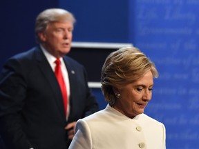 Former Democratic nominee Hillary Clinton and U.S. President Donald Trump walking off the stage after the final presidential debate at the Thomas Mack Center on the campus of the University of Las Vegas in Las Vegas, Nevada.