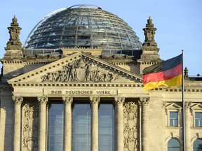 The German national flag is seen in front of the Reichstag building housing the German parliament Bundestag.
