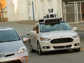 An Uber driverless Ford Fusion drives down Smallman Street on September, 22, 2016 in Pittsburgh, Pennsylvania.