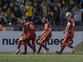 Toronto FC players celebrate a Sebastian Giovinco goal against Tigres on March 13.