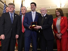 William Clarke (third right),  accepts Congressional Gold Medal at the U.S. Capitol on March 21, 2018 in Washington, D.C.   Members of the Office of Strategic Services were presented with the the highest award given by Congress to honour the agency for its contributions during World War II.