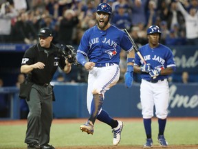 Kevin Pillar of the Blue Jays celebrates after stealing home plate in the eighth inning of their game against the New York Yankees at Rogers Centre in Toronto on Saturday.
