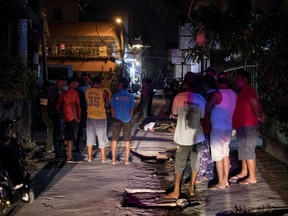 The body of an alleged drug dealer lies on the ground after he was killed by an unidentified assailant in Manila on March 23, 2018.   President Rodrigo Duterte is taking the country out of the International Criminal Court over its inquiry into his deadly drug war.