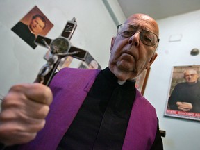 This file photo taken on October 10, 2005 shows Don Gabriele Amorth, exorcist in the diocese of Rome and the president of honour of the Association of Exorcists, posing in Rome.