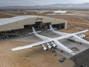 Paul Allen's Stratolaunch airplane emerges from its hangar in Mojave, California on May 31, 2017.