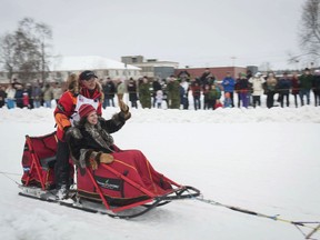 Defending champion Mitch Seavey rounds a turn during the ceremonial start of the Iditarod Trail Sled Dog Race, Saturday, March 3, 2018, in Anchorage, Alaska.