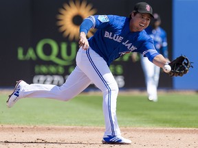 Toronto Blue Jays shortstop Aledmys Diaz runs down a ball to turn a double play during spring training action in Dunedin, Fla. on Friday, February 23, 2018. (THE CANADIAN PRESS/Frank Gunn)