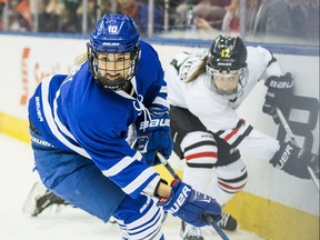 Kelly Terry, foreground, and Meghan Grieves participate in the CWHL All-Star Game at the Air Canada Centre in Toronto on Feb. 11, 2017.