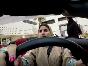 Sara Ghouth, 18-year-old student at Effat University, sits for the first time in the driver's seat, during training sponsored by Ford Motor, in Jiddah, Saudi Arabia, Tuesday, March 6, 2018. A stunning royal decree issued last year by King Salman announcing that women would be allowed to drive in 2018 upended one of the most visible forms of discrimination against women in Saudi Arabia.