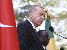 Turkish President Recep Tayyip Erdogan, front, and Senegal's President Macky Sall speak during a joint news conference after talks in Dakar, Thursday, March 1, 2018. Erdogan is in Senegal for a two-day visit aimed at boosting the political and economic cooperation between the two countries.