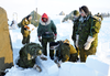 Master Corp. Matthew Manik teaches soldiers how to build a snow wall to block the wind from their tent.