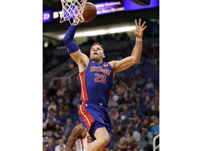 Detroit Pistons forward Blake Griffin (23) shoots against the Phoenix Suns during the first half of an NBA basketball game Tuesday, March 20, 2018, in Phoenix.
