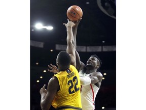 Arizona forward Deandre Ayton shoots over California center Kingsley Okoroh (22) during the second half of an NCAA college basketball game, Saturday, March 3, 2018, in Tucson, Ariz. Arizona defeated California 66-54.