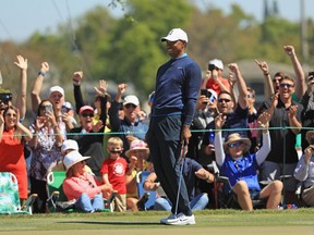 Tiger Woods reacts to his birdie putt on the seventh hole in the first round at the Arnold Palmer Invitational on March 15.