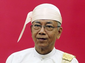 FILE - In this Wednesday, Oct. 11, 2017, file photo, Myanmar's President Htin Kyaw stands during an event to accept credentials from foreign ambassadors in Naypyitaw, Myanmar. Htin Kyaw, a close friend of leader Aung San Suu Kyi, has announced that he is retiring. A statement posted Wednesday on the Myanmar President Office's Facebook page said that he was retiring from his duties.