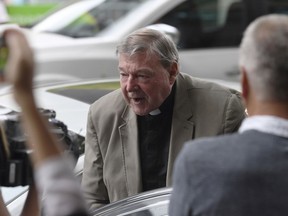 Cardinal George Pell arrives at the Melbourne Magistrates Court, Thursday, March 29, 2018, in Melbourne, Australia. An Australian magistrate has closed a monthlong court hearing of evidence on whether Pell, the most senior Vatican cleric ever charged in the Catholic Church sex abuse crisis, will stand trial.