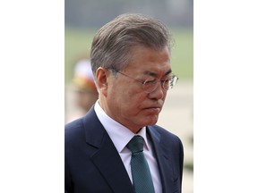 South Korean President Moon Jae-in attends a wreath laying ceremony at the mausoleum of Vietnamese late President Ho Chi Minh in Hanoi, Vietnam, Friday, March 23, 2018. Moon is on a three-day state visit to Vietnam.