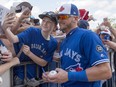 Toronto Blue Jays 3B Josh Donaldson poses for photos as he signs autographs at spring training in Dunedin, Fla. on Tuesday, Feb. 27, 2018.