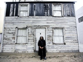 FILE - In this April 6, 2017 file photo, Rhea McCauley, a niece of the late civil rights activist Rosa Parks, poses in front of the rebuilt house of Rosa Parks in Berlin. Brown University announced Thursday, March 8, 2018, it has canceled plans to display the house where Rosa Parks lived after sparking the Montgomery bus boycott.