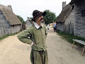 FILE - In this Sept. 9, 2008 file photo, an employee of Plimoth Plantation portrays Edward Winslow at Plimoth Plantation's 1627 English Village, in Plymouth, Mass. Actors who portray the Pilgrims, along with other unionized employees, are back on the picket line in 2018, demanding better pay and benefits.