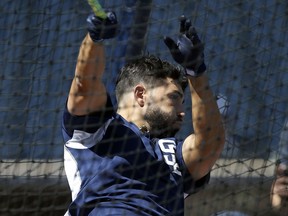 San Diego Padres first baseman Eric Hosmer swings away during batting practice before an opening day baseball game against the Milwaukee Brewers in San Diego, Thursday, March 29, 2018.